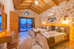 a bedroom with two beds in a room at Villa estrella in Kaş +21 photos
