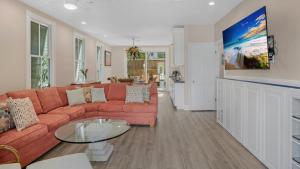 a living room with a couch and a table at Sea Breeze Villa in Key West