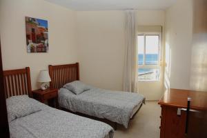 A bed or beds in a room at JSM Apartamentos Még 37 kép