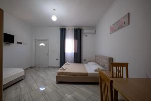 Postel nebo postele na pokoji v ubytování Vila Mario