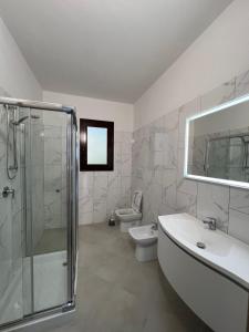 Koupelna v ubytování Eraldo Rooms