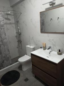 a bathroom with a sink and a toilet and a shower at ThaniaS'S Studio 1 in Tríkala +14 photos