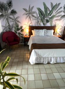 Postel nebo postele na pokoji v ubytování Hotel Casa Paradiso Guarujá