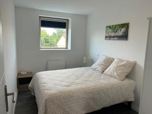Ένα ή περισσότερα κρεβάτια σε δωμάτιο στο Appartement cosy