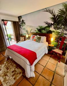 Postel nebo postele na pokoji v ubytování Hotel Casa Paradiso Guarujá
