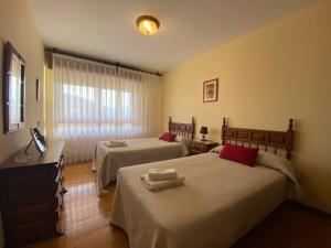 A bed or beds in a room at La Quintana de Villar