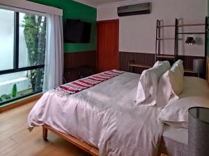 Postelja oz. postelje v sobi nastanitve Hotel Boutique Típico
