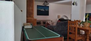 a living room with a ping pong table at Cueva En El Geoparque de Granada in Bejarín