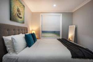Devan House - An Entertainers' Retreat Close to Town客房内的一张或多张床位