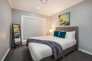 Devan House - An Entertainers' Retreat Close to Town客房内的一张或多张床位