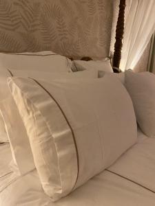 Uma cama ou camas num quarto em Hotel Lusitano