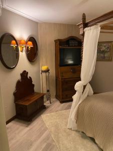 Uma cama ou camas num quarto em Hotel Lusitano