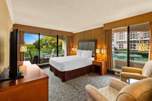 a hotel room with a bed and a balcony at Best Western PLUS Inner Harbour Hotel in Victoria +95 photos