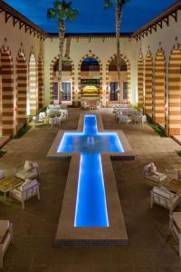 a fountain in the middle of a courtyard at Marina Resort Port Ghalib, a member of Radisson Individuals in Port Ghalib