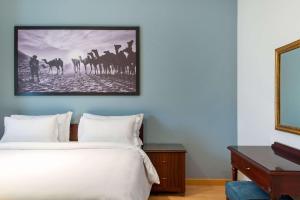 A bed or beds in a room at Marina Resort Port Ghalib, a member of Radisson Individuals
