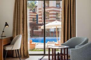The swimming pool at or close to Marina Resort Port Ghalib, a member of Radisson Individuals