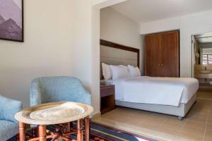 A bed or beds in a room at Marina Resort Port Ghalib, a member of Radisson Individuals