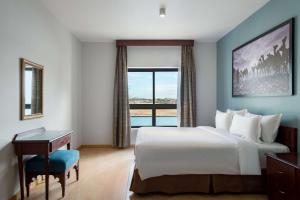 A bed or beds in a room at Marina Resort Port Ghalib, a member of Radisson Individuals