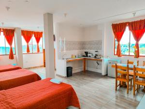 Kuchyň nebo kuchyňský kout v ubytování Suites en el Centro