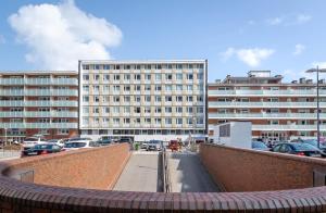 a view of a parking lot with a large building at Ad3 5F Luxury West in Westerland