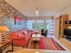 TV a/nebo společenská místnost v ubytování Ferienhaus Herkommer Norddeich