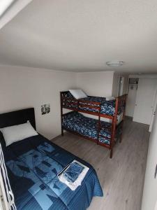 a bedroom with two bunk beds in a room at Terrazas del sol IV in La Serena +25 photos
