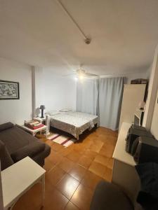 ein Wohnzimmer mit einem Bett und einer Couch in der Unterkunft Nice apartment on Las Americas Beach in Playa de las Americas