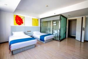 A bed or beds in a room at Juli Boutique Hotel