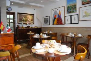 a restaurant with tables and chairs and a counter at Pousada Bahia Pelô in Salvador