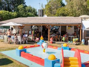 a water park with a pool with balls in it at Charming Breebos Getaway in Rijkevorsel