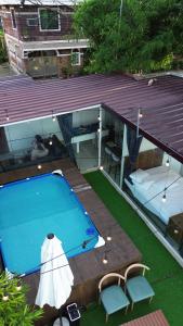 Afbeelding uit fotogalerij van Glass Cabin Secluded Overlooking Oasis with pool in San Jose del Monte