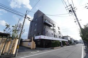 a building on the side of a street at プリンセスプリンセス秋田大町 in Akita
