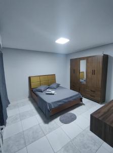 En eller flere senge i et værelse på Menino Jesu Área de Lazer