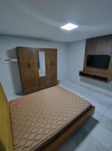 En eller flere senge i et værelse på Menino Jesu Área de Lazer + 23 billeder