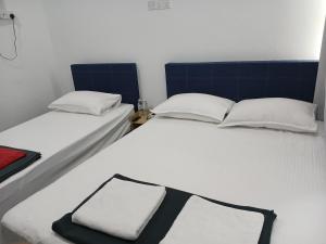 Postel nebo postele na pokoji v ubytování Enviropath Hotel