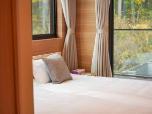 Postel nebo postele na pokoji v ubytování hirafu3 Near Niseko Resort Cozy Apt for 6PPL + 38 fotografií