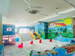 a childs room with a play area with ayden at Khách Sạn Hoàng Mấm Minh Cầu - Best City view in Thái Nguyên