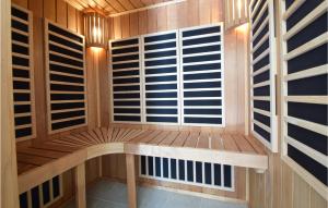 a sauna with a bench and a window at Awesome Home In Otterup With Wifi in Otterup