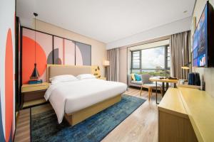 Krevet ili kreveti u jedinici u okviru objekta Echarm Hotel Kunming Changshui International Airport