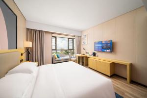 TV i/ili multimedijalni sistem u objektu Echarm Hotel Kunming Changshui International Airport