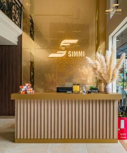 a restaurant with a counter in a store at Simmi 6 Hotel & Apartment in Ho Chi Minh City
