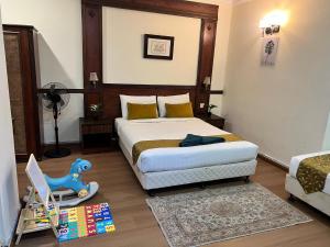 Postel nebo postele na pokoji v ubytování Melur Inn