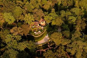 an aerial view of a house in the middle of a forest at Chivit Thamma Da Mountain Home in Mae Chan
