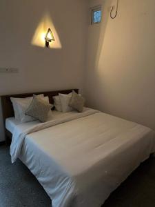 Ένα ή περισσότερα κρεβάτια σε δωμάτιο στο M&M Villa