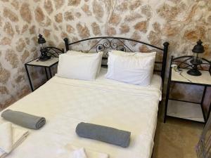 a bedroom with a bed and two night stands at Villa Olive Garden, Kalkan ClubPatara in Kalkan +38 photos