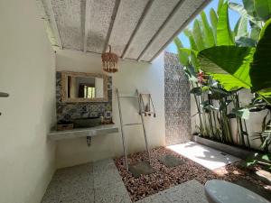 a bathroom with a mirror and a sink at Penida West palm cottage in Nusa Penida +90 photos
