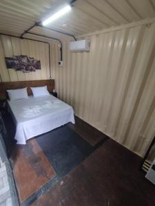 a bedroom with a bed in a room at MOTO Inn URUBICI in Urubici