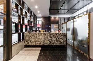a bar in a restaurant with a counter at Zenith Hotel Bupyeong in Incheon