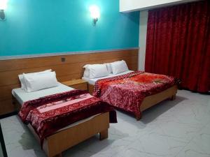 Postel nebo postele na pokoji v ubytování Hotel Al badar