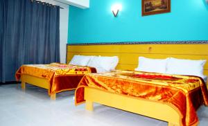 Postel nebo postele na pokoji v ubytování Hotel Al badar
